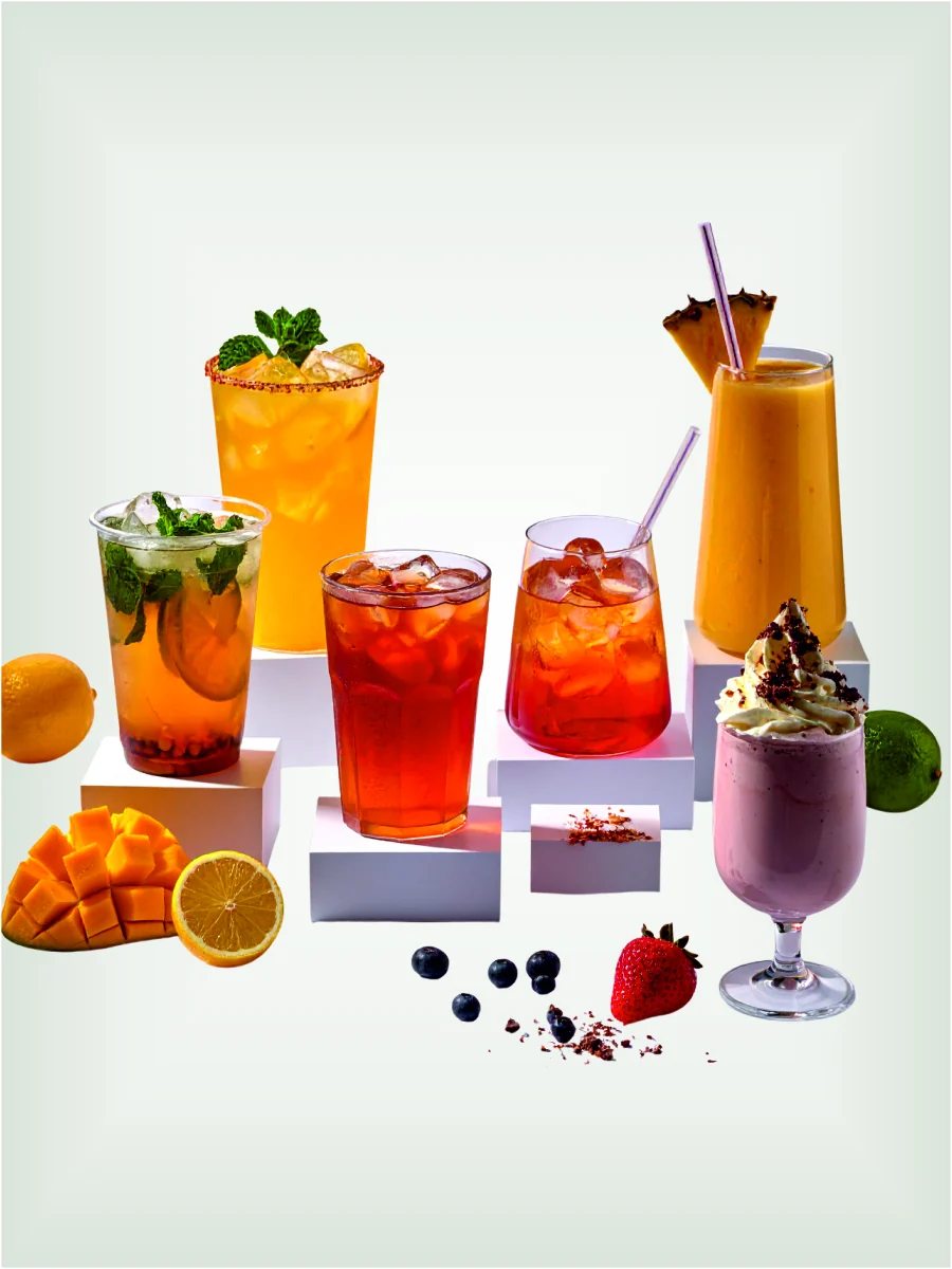 The Tea Planet beverage mixes — mojito, citrus cooler, iced teas, mango smoothie and a berry milkshake on ice
