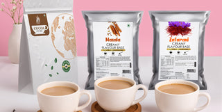 Three bags of coffee flavor bases with corresponding cups of coffee on a pink background